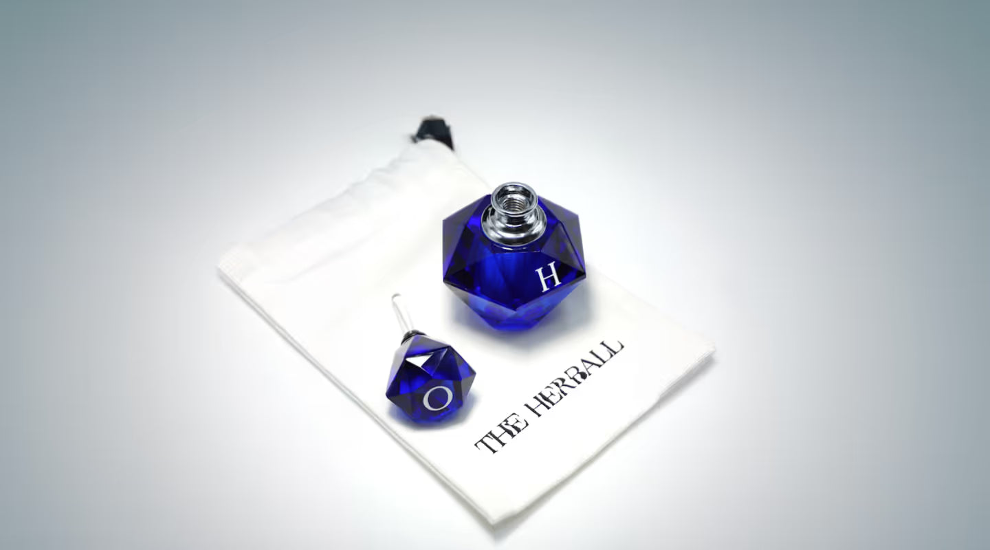 A pair of blue dices sitting on top of a piece of paper