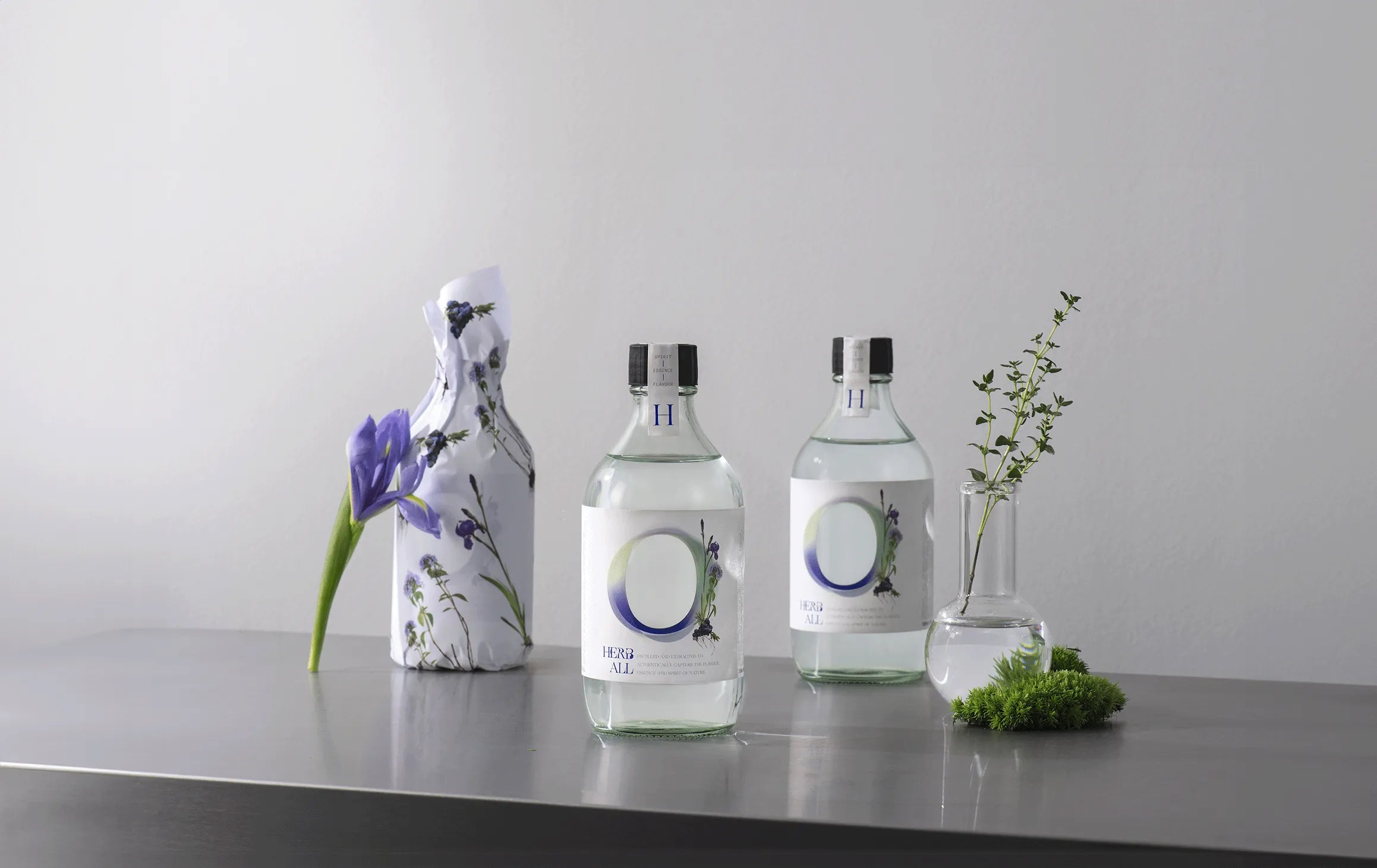 Three bottles of water sitting on top of a table